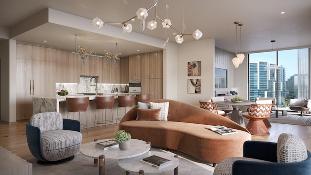 living area featuring a city view, light wood-style flooring, and expansive windows