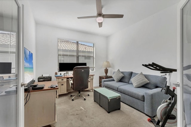 office area with light carpet and a ceiling fan