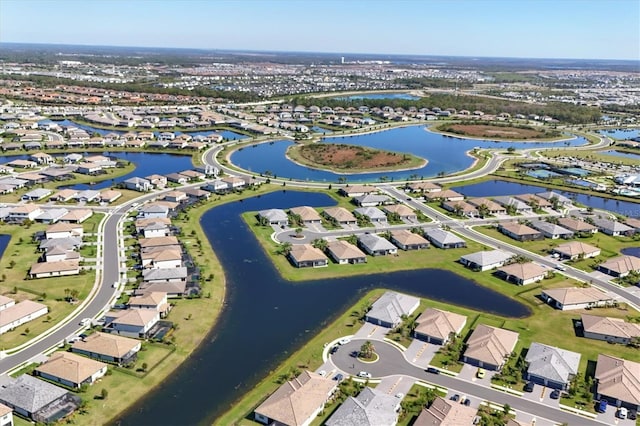bird's eye view with a residential view and a water view