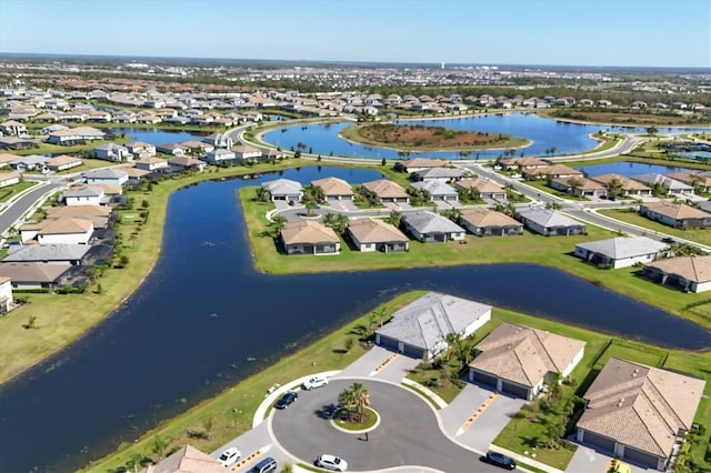 aerial view featuring a residential view and a water view