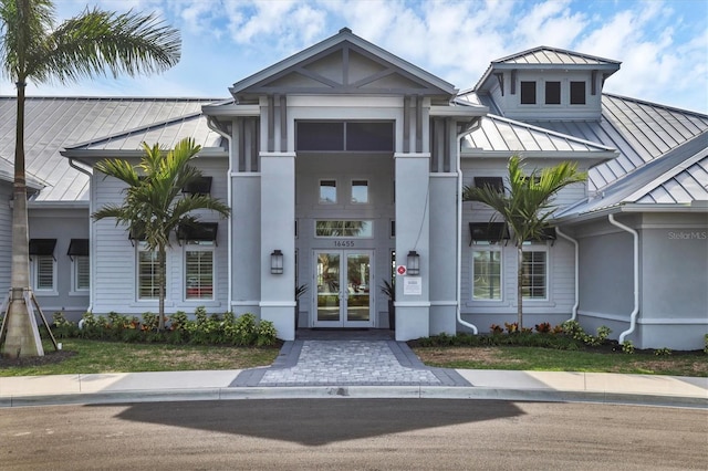 exterior space featuring metal roof, french doors, and a standing seam roof