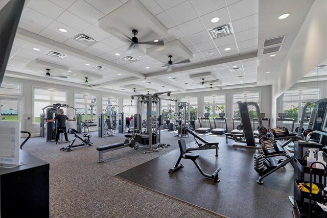 workout area with visible vents and ceiling fan