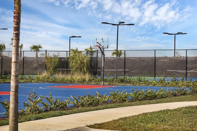 view of sport court featuring community basketball court and fence