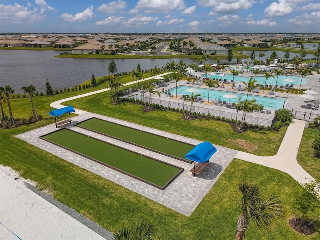 surrounding community featuring a yard, a residential view, a water view, and fence