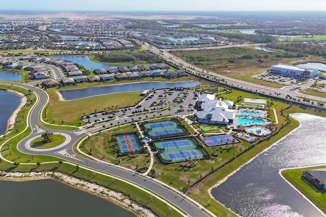 birds eye view of property with a water view