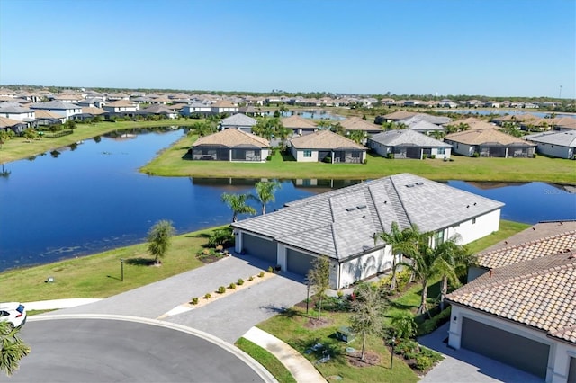 bird's eye view with a residential view and a water view