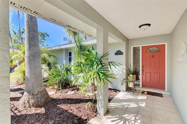 entrance to property with stucco siding