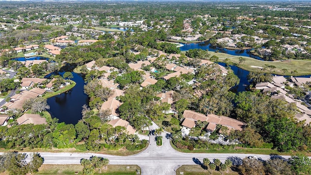 birds eye view of property featuring a residential view and a water view