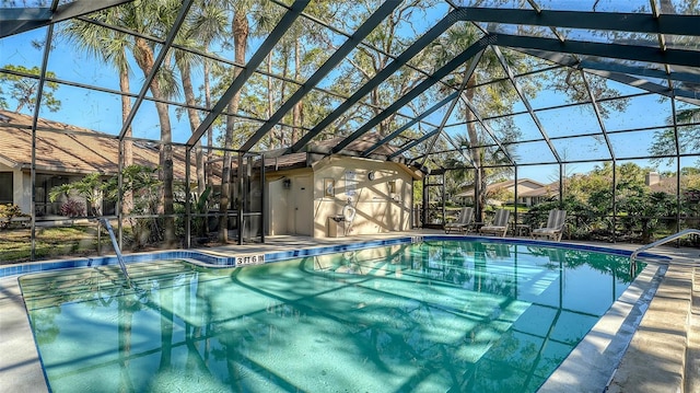 outdoor pool featuring a lanai and a patio area