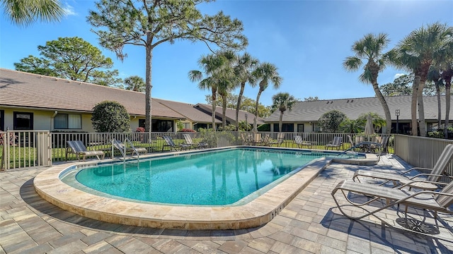 pool featuring a patio and fence