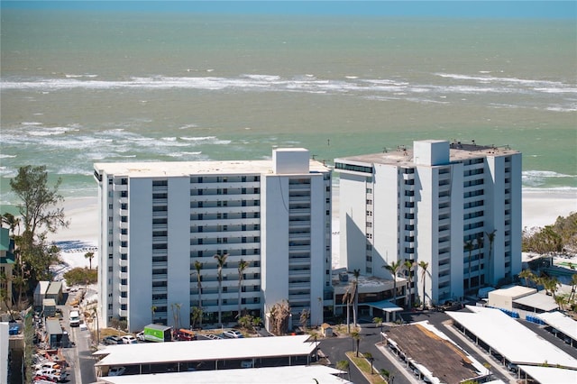 aerial view featuring a view of the beach and a water view