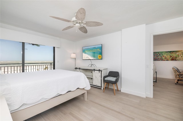 bedroom with access to exterior, a ceiling fan, baseboards, and light wood finished floors