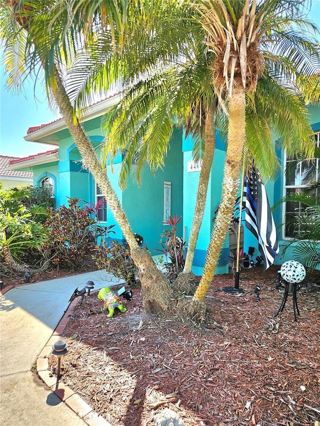 exterior space with a tile roof