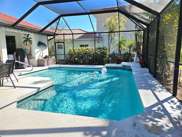 pool with a lanai and a patio