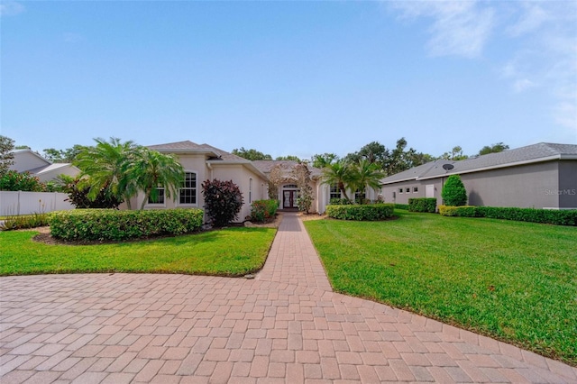 2114 147th Ct E, Bradenton, FL 34212 - view of front facade with a front yard, a garage, and stucco siding