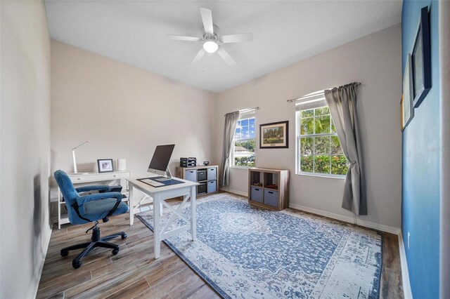 2114 147th Ct E, Bradenton, FL 34212 - home office with wood finished floors, ceiling fan, and baseboards