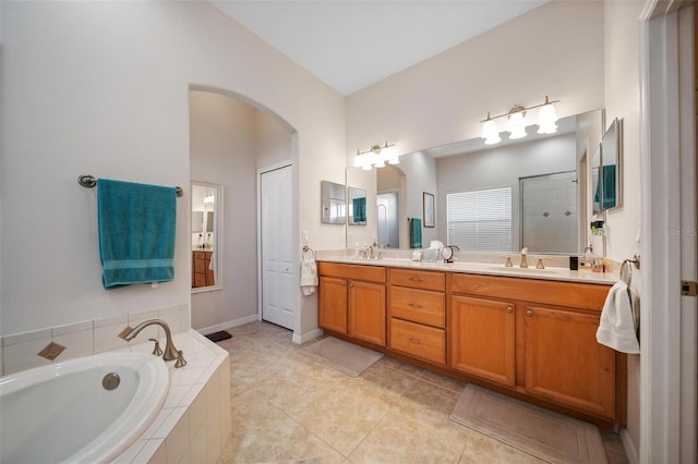 2114 147th Ct E, Bradenton, FL 34212 - bathroom featuring double vanity, a bath, a sink, and a stall shower