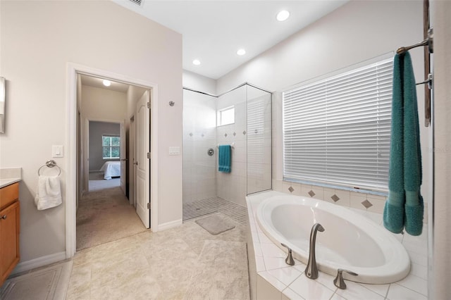 2114 147th Ct E, Bradenton, FL 34212 - bathroom with a tile shower, a bath, vanity, recessed lighting, and baseboards
