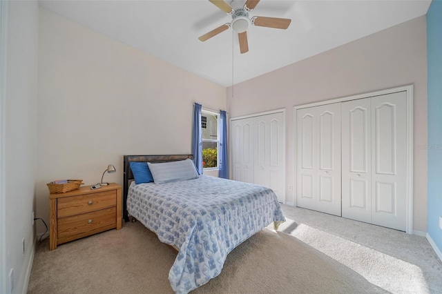 2114 147th Ct E, Bradenton, FL 34212 - bedroom with baseboards, two closets, ceiling fan, carpet, and vaulted ceiling