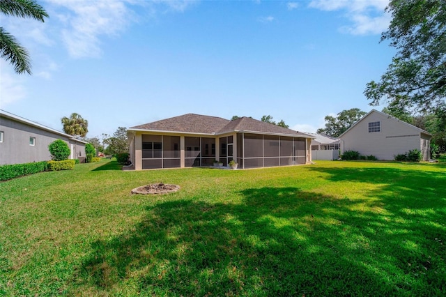 2114 147th Ct E, Bradenton, FL 34212 - back of property with a sunroom and a lawn