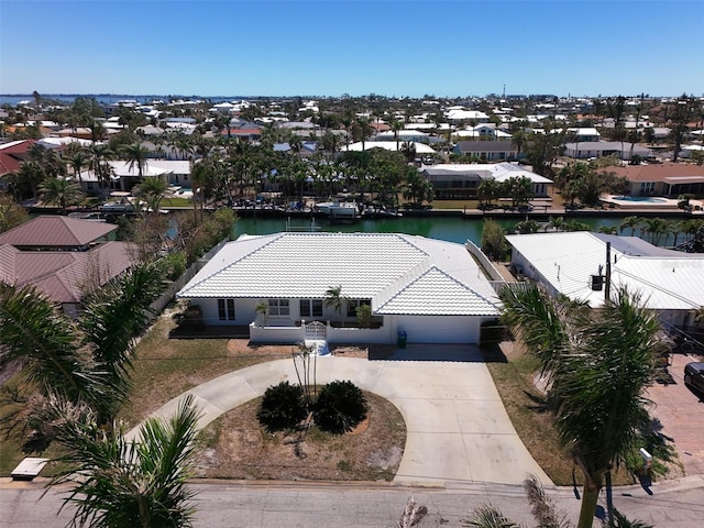 bird's eye view with a residential view and a water view