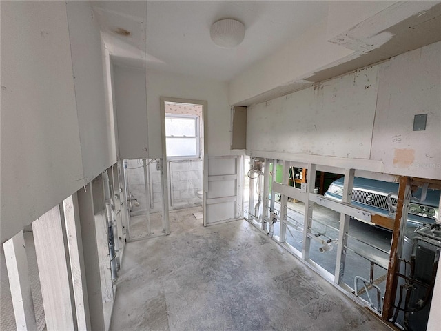 interior space with unfinished concrete flooring