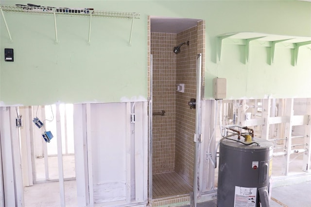 bathroom with a shower stall and electric water heater