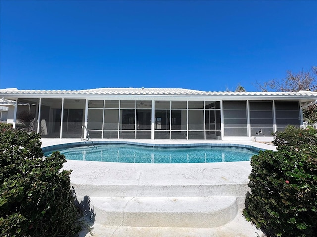 pool with a sunroom