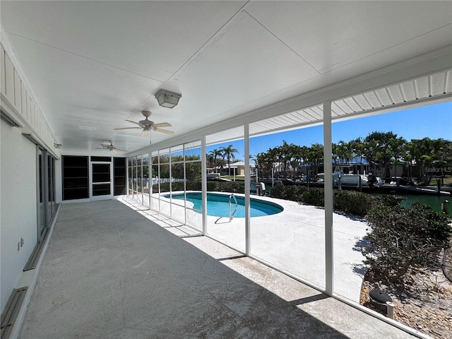 pool featuring a ceiling fan and a patio