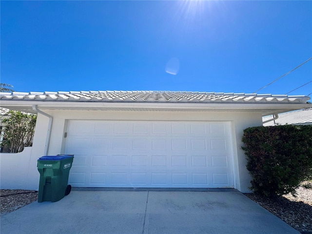 garage featuring driveway