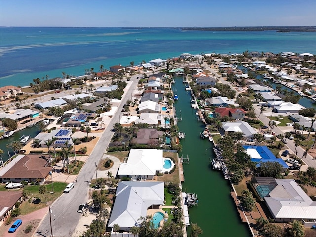 bird's eye view featuring a residential view and a water view