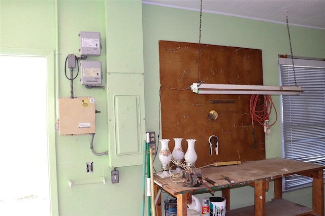 dining space featuring electric panel and a workshop area