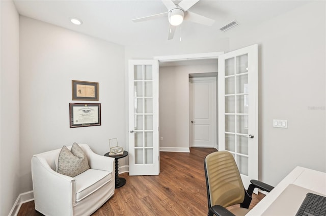 office space with visible vents, baseboards, french doors, wood finished floors, and a ceiling fan