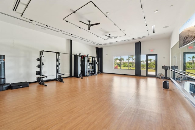 exercise room with wood finished floors