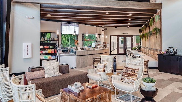 living area with beamed ceiling