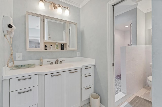 full bathroom featuring tile patterned floors, toilet, crown molding, walk in shower, and vanity