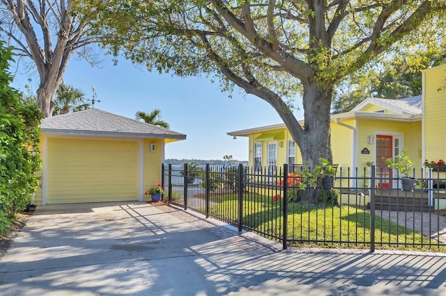 exterior space with driveway and fence