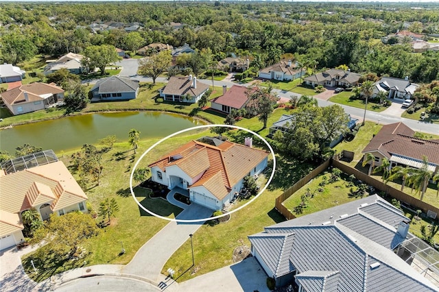 bird's eye view featuring a residential view and a water view