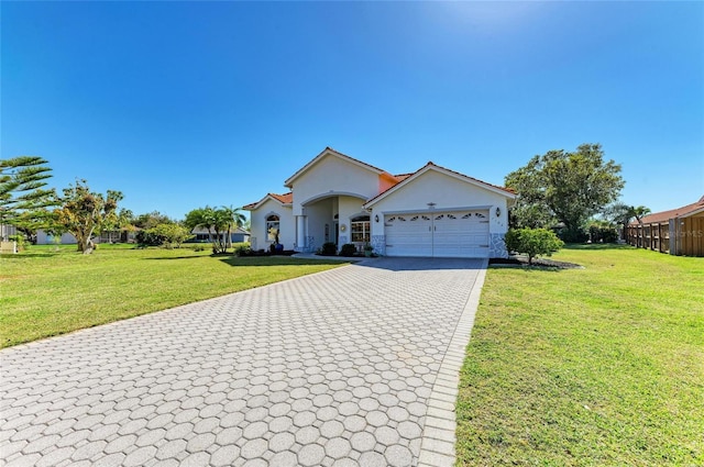 ranch-style home with stucco siding, a front lawn, decorative driveway, and a garage