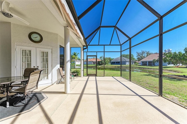 unfurnished sunroom with french doors