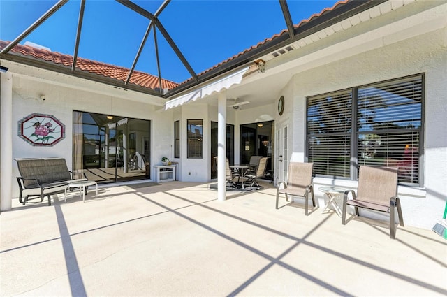 view of patio / terrace with a lanai