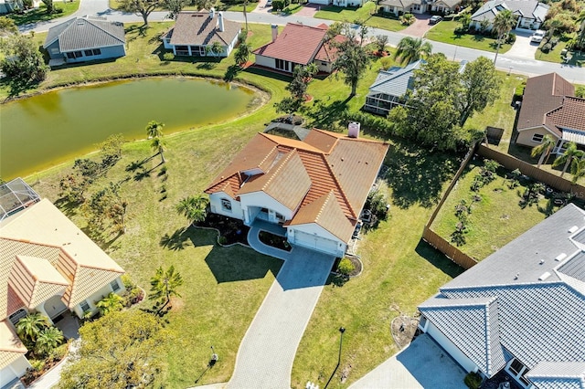 bird's eye view featuring a residential view and a water view