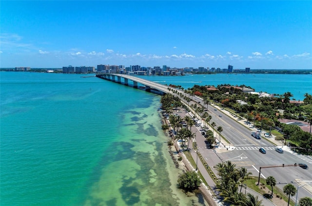 aerial view featuring a city view and a water view