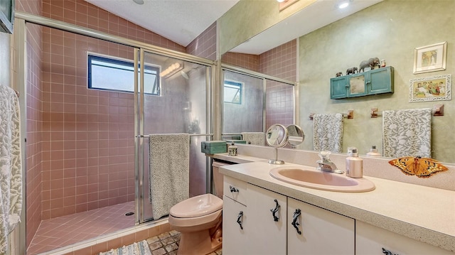 bathroom with lofted ceiling, toilet, a stall shower, and vanity