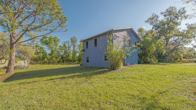 view of home's exterior featuring a lawn