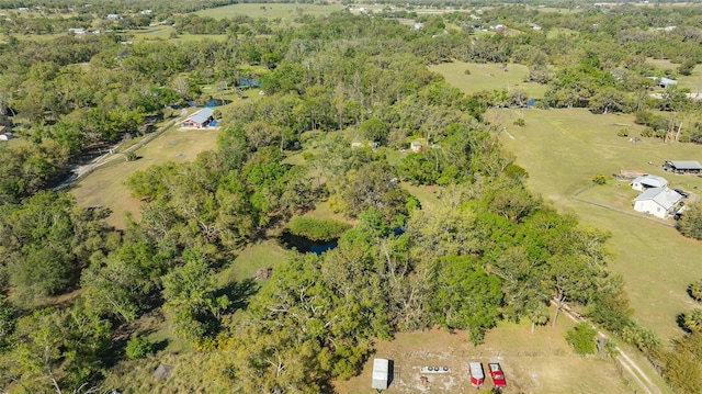 bird's eye view featuring a rural view and a forest view