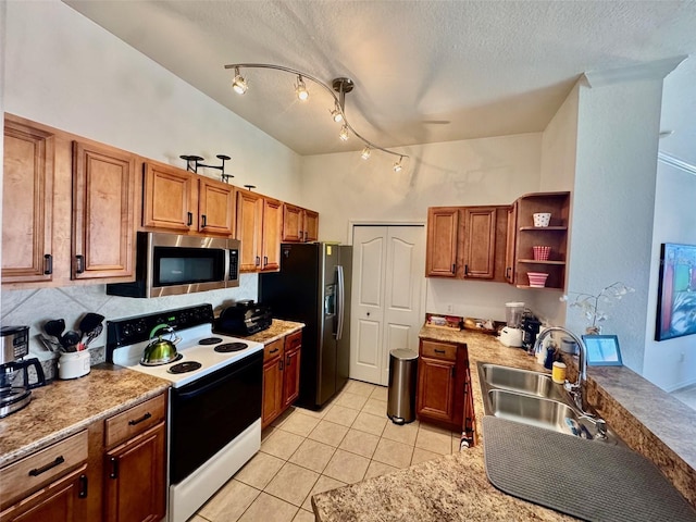 kitchen featuring open shelves, electric range, a sink, stainless steel microwave, and refrigerator with ice dispenser