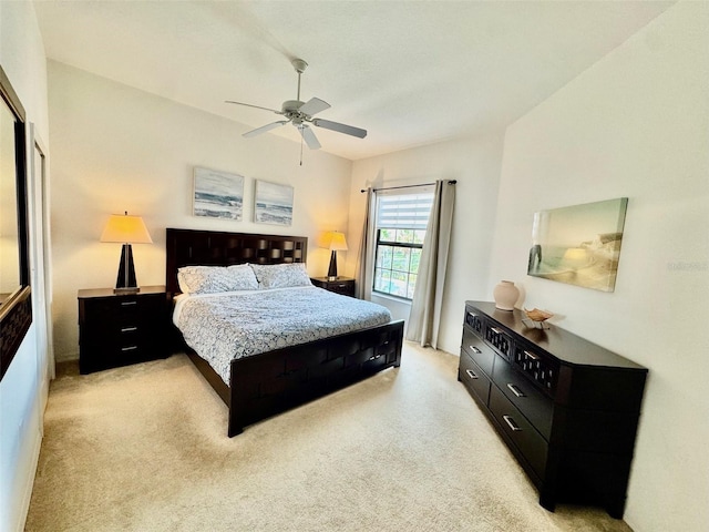 bedroom with light carpet and ceiling fan