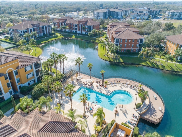 drone / aerial view featuring a water view and a residential view