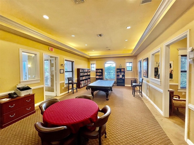 game room featuring baseboards, visible vents, a tray ceiling, recessed lighting, and ornamental molding